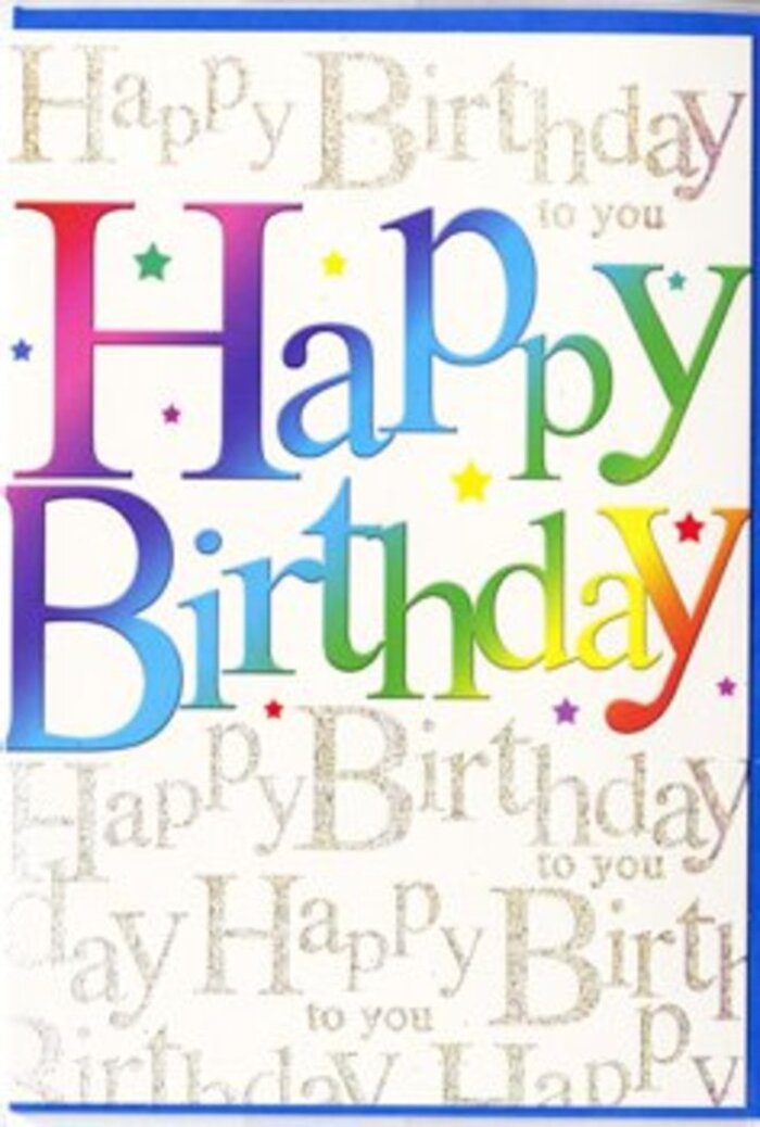 The photograph captures a single birthday card set upright, showcasing a cover that radiates colourful optimism, much like the modern skyline that defines the Docklands. The dominant feature is the phrase Happy Birthday, written in oversized, friendly block letters that span nearly the full width of the card. Each letter is bathed in a gentle rainbow gradient, starting in bold ruby and crimson, moving through fiery orange and rich fuchsia, then easing into cool greens, aqua blues, and soft, buttery yellows. The colours merge smoothly, with no harsh lines, suggesting a sense of flow and harmony similar to the constant movement of boats and trains around Canary Wharf. A subtle gloss on the lettering catches light, adding a lively sheen that keeps the design feeling crisp and fresh. Behind the main words, the background is densely filled with repeated lines of Happy Birthday to you written in slender, graceful golden script. The metallic ink glimmers delicately under the light, forming a pattern that almost resembles festive streamers when viewed from a little distance. Tiny stars and sprinkled dots in bright, jewel-like tones are scattered over and between the letters, like small bursts of confetti drifting down at the end of a party. The layout is carefully balanced, ensuring that the bold greeting, the shimmering script, and the playful confetti all work together rather than compete. It conveys the feeling of a well-planned celebration-a card that you might send along with a hand-tied arrangement from a Docklands florist to brighten a birthday in an apartment overlooking the water or an office on the upper floors of a glass tower.